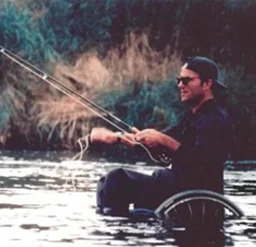 a man in a wheelchair fishing