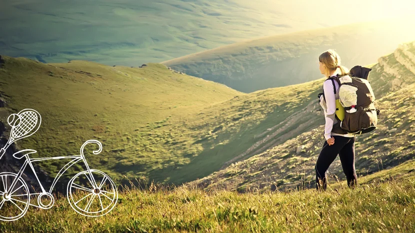 a man walking on a hill